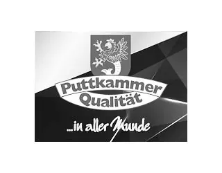 Puttkammer Qualität logo featuring a crest and the slogan '... in aller Welt'.